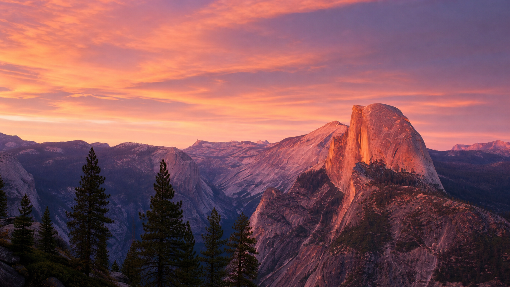 Alpenglow sunset over Yosemite Valley with Half Dome in the background.